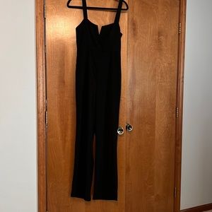 “About us” black jumpsuit from Revolve
